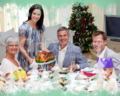 Family celebrating christmas dinner with turkey