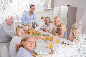 Composite image of father cutting turkey and looking at camera