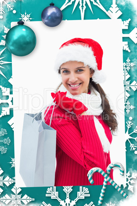Composite image of beautiful festive woman holding shopping bag