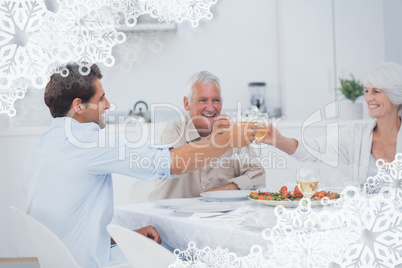 Composite image of family clinking their glasses of white wine