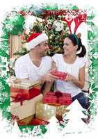Happy couple giving presents for christmas