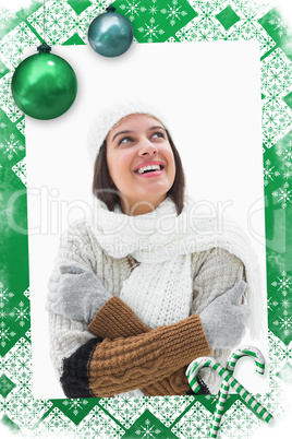 Composite image of pretty brunette in warm clothes