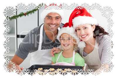 Happy woman with husband and daughter with their biscuits ready