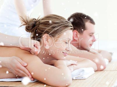 Composite image of loving couple having an acupunctre therapy