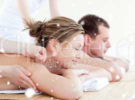 Composite image of loving couple having an acupunctre therapy