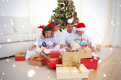 Young family unpacking christmas presents