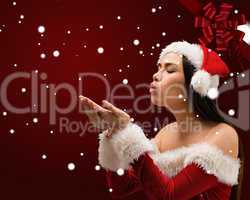 Composite image of pretty brunette in santa outfit blowing over