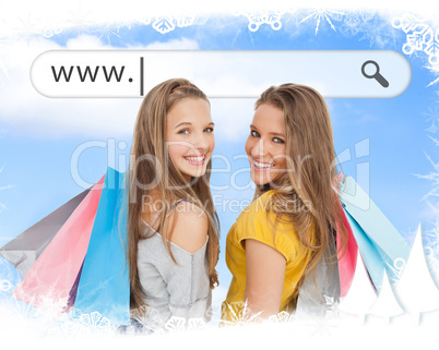 Smiling girls with their shopping bags under address bar