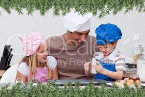 Father and children baking in the kitchen