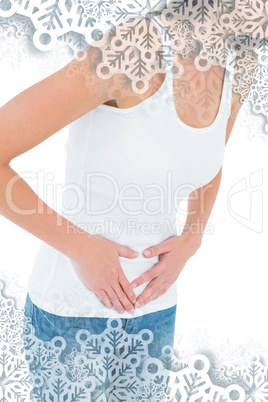 Closeup mid section of a casual woman with stomach pain