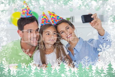 Woman taking pictures of her family during a birthday party