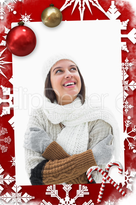 Composite image of pretty brunette in warm clothes