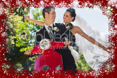 Newlywed couple sitting on scooter in park