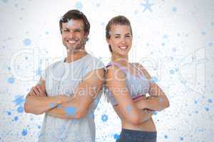 Portrait of a sporty young couple with arms crossed