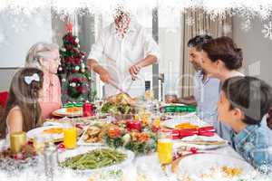 Extended family at dining table for christmas dinner in house