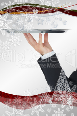 Welldressed man holding silver tray