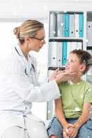 Composite image of doctor examining thyroid gland of boy