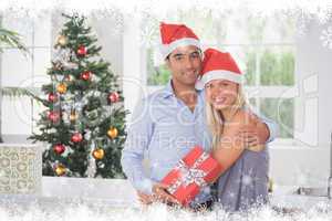 Composite image of happy couple at christmas