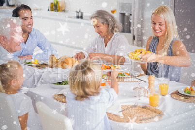 Composite image of happy family eating the thanksgiving dinner