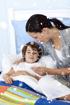 Composite image of mother taking her sons temperature