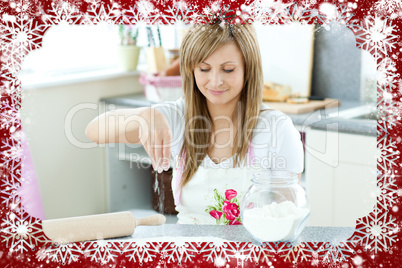 Portrait of a cute woman preparing a cake in the kitchen