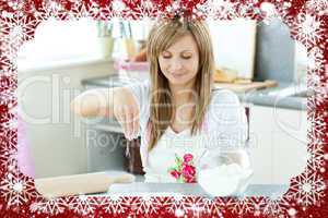 Portrait of a cute woman preparing a cake in the kitchen