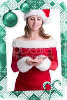 Composite image of pretty woman in santa costume presenting your product