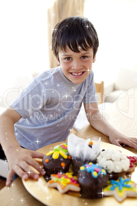 Composite image of happy boy eating colorful confectionery