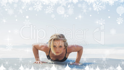 Composite image of fit blonde in plank position on the beach