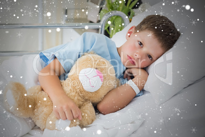 Little boy with teddy bear in hospital