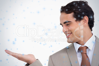 Close up of smiling salesman looking at his palm