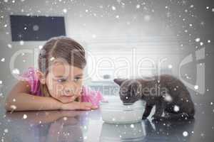 Composite image of girl looking at kitten drinking milk from bow