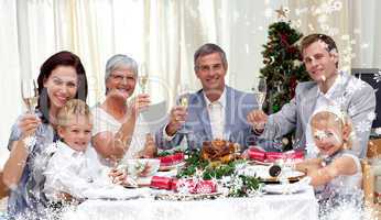 Composite image of family tusting in a christmas dinner with whi