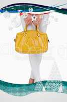 Composite image of woman in high heels holding yellow bag