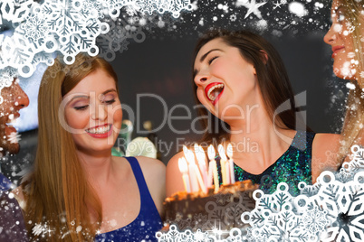 Composite image of cheerful friends celebrating birthday togethe