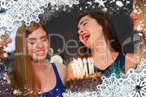 Composite image of cheerful friends celebrating birthday togethe