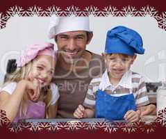 Happy father and children baking cookies together