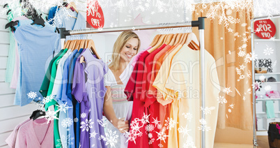 Composite image of merry blond woman choosing colorful clothes