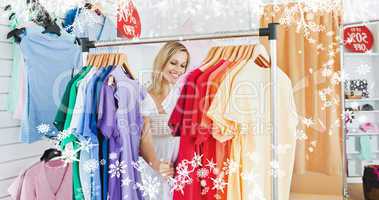 Composite image of merry blond woman choosing colorful clothes