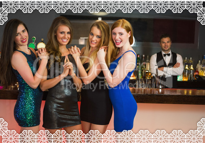 Sexy friends posing in front of barkeeper