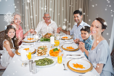 Portrait of an extended family at dining table