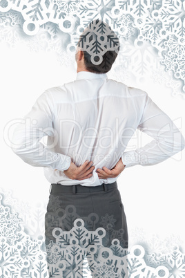 Portrait of the painful back of a young businessman
