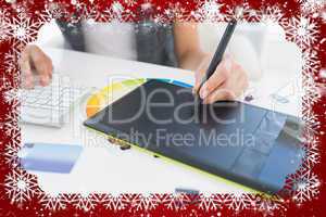 Female photo editor using graphics tablet