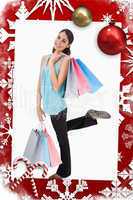 Portrait of a cheerful woman posing with shopping bags