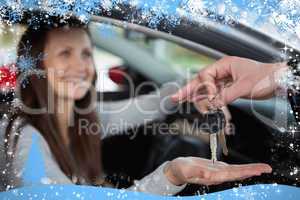 Composite image of happy woman receiving car keys