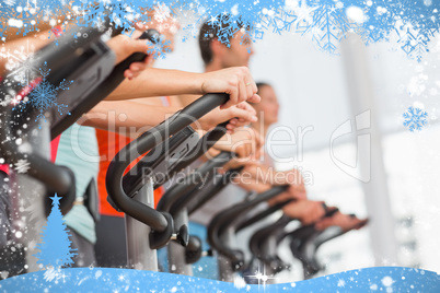 Fit people working out at spinning class