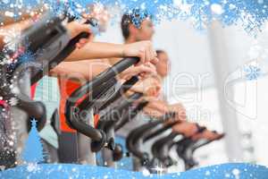 Fit people working out at spinning class