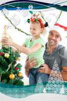 Happy father helping his daughter to put an angel on the christm