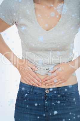 Composite image of woman with abdominal pain
