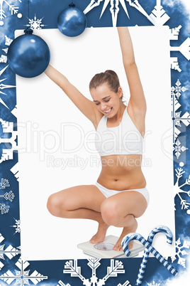 Composite image of happy attractive woman crouching on a scales